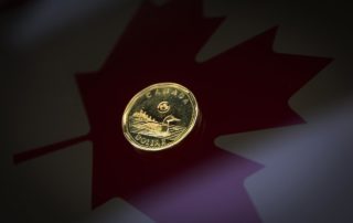 Canadian dollar weakens as oil prices shrug off output cut