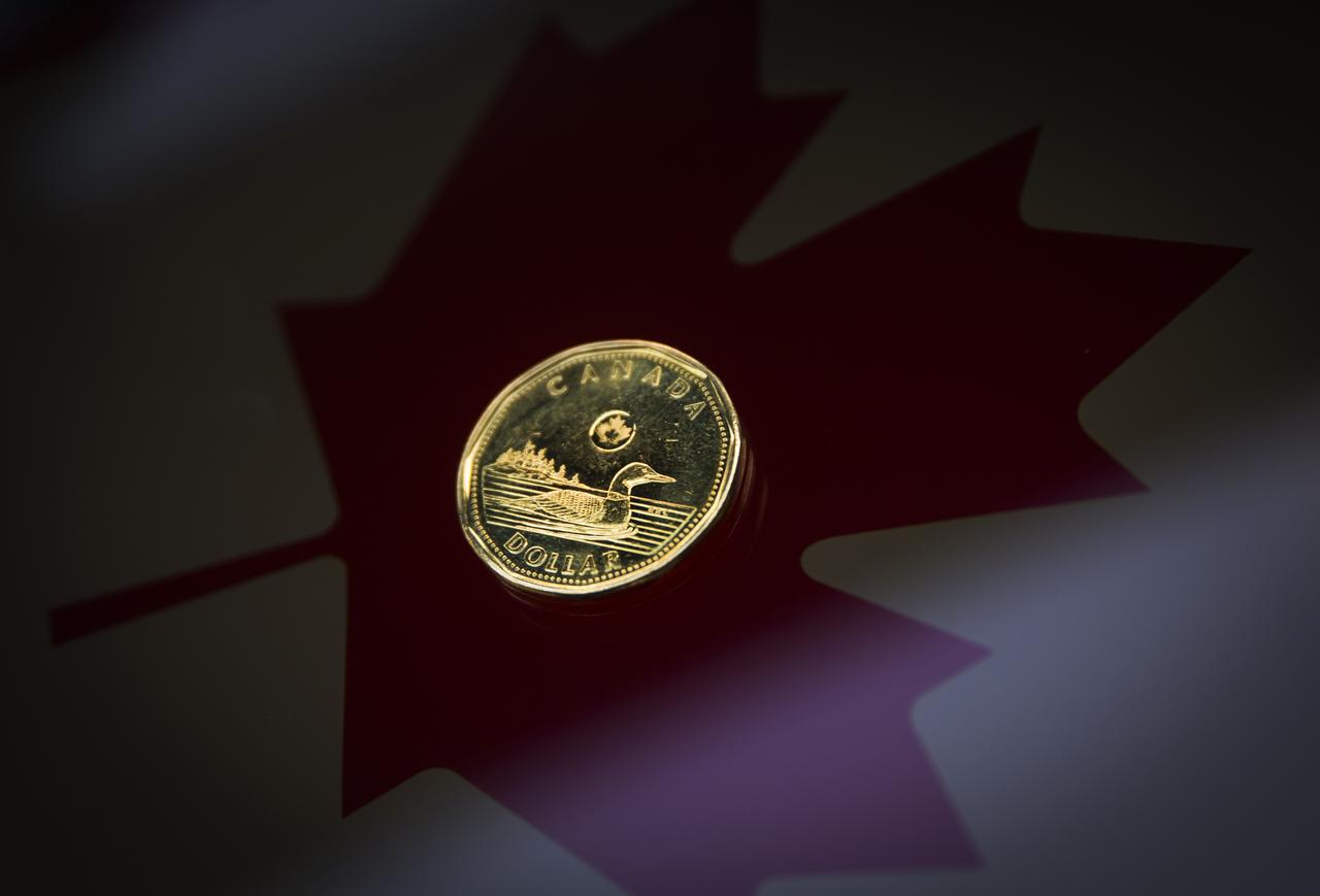 Canadian dollar weakens as oil prices shrug off output cut
